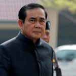 Thailand’s Prime Minister Prayuth Chan-ocha is dressed in black as he arrives at a weekly cabinet meeting at Government House in Bangkok